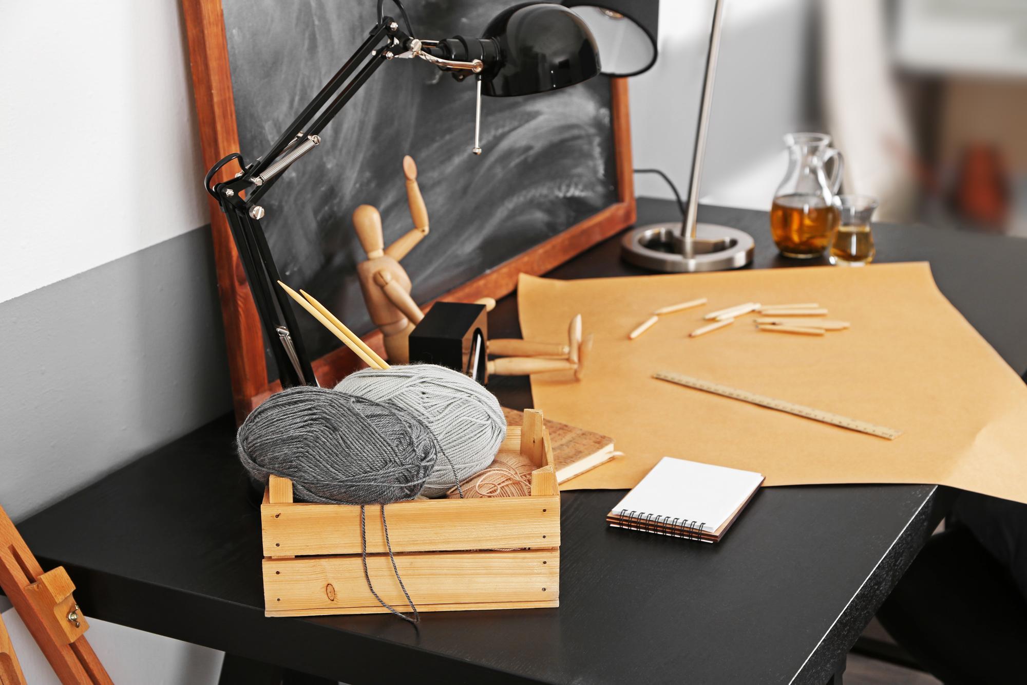 Studio view with threads and hoops on table