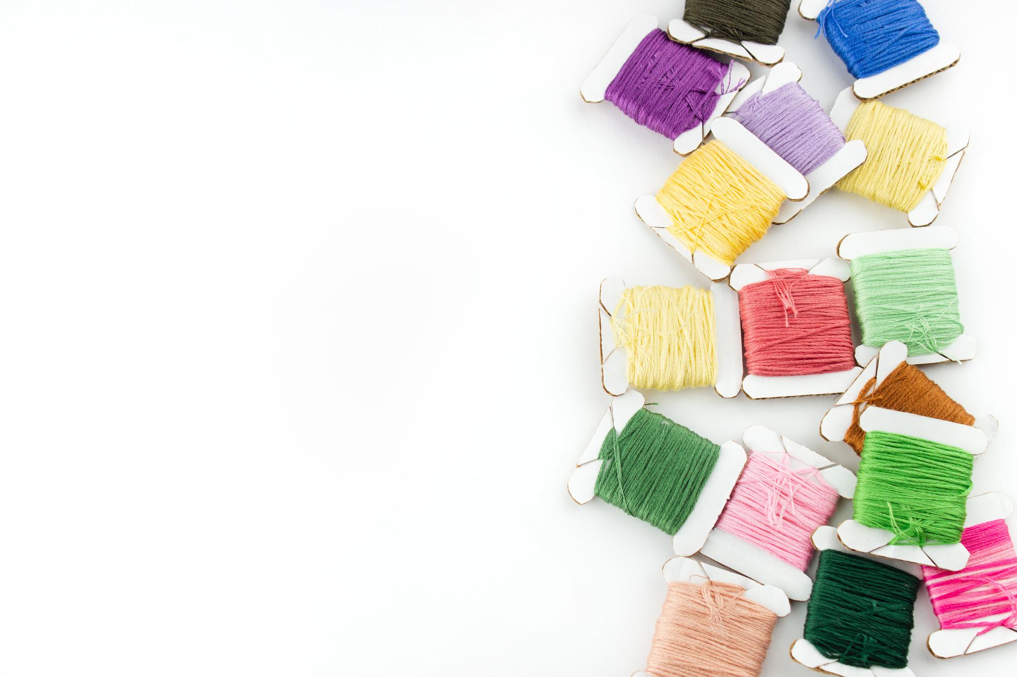 Selection of colorful threads and finished patches